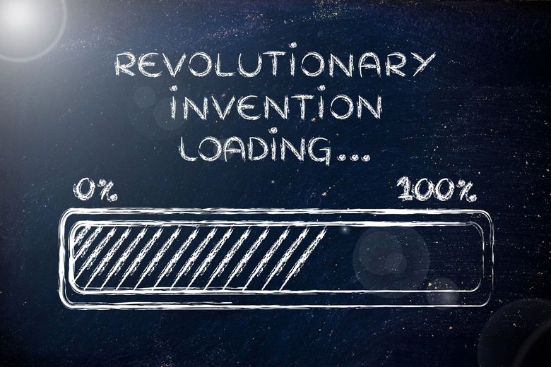 blackboard with revolutionary invention loading written on